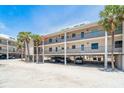 Exterior view of the property showcasing its raised design and ample parking at 2700 N Beach Rd # A201, Englewood, FL 34223