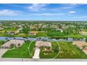 Serene waterfront home showcasing an expansive backyard and a private canal setting in a quiet neighborhood at 29 Tournament Rd, Rotonda West, FL 33947