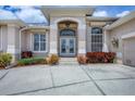 Stately home featuring an arched doorway with glass doors and side panel windows at 585 Coral Creek Dr, Placida, FL 33946