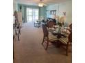 Bright living room boasts a seamless flow, connecting the dining area to the comfortable seating area at 708 Tamiami S Trl # 216, Venice, FL 34285