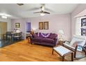 Comfortable living room with hardwood floors, neutral tones, and a dining area at 7180 Quarry St, Englewood, FL 34224