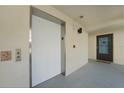 Well-maintained hallway features an elevator and a unit entrance, offering convenience and accessibility at 1501 Beach Rd # 303, Englewood, FL 34223