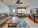 Comfortable living room with modern furniture and a large television at 1605 Manor Rd, Englewood, FL 34223