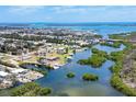 Stunning aerial view of coastal community with waterfront homes and lush greenery, showcasing a tranquil and picturesque setting at 2117 Michigan Ave, Englewood, FL 34224
