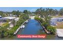 Scenic view of the community boat ramp with boats docked, offering waterfront access and recreation at 2117 Michigan Ave, Englewood, FL 34224