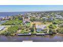 A scenic aerial view of waterfront homes, docks, and canals in a beautiful community at 2441 Vance Ter, Port Charlotte, FL 33981