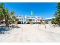 Charming beach homes on stilts with sandy surroundings under a bright blue sky at 301 S Gulf Blvd # 3, Placida, FL 33946