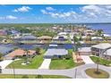 Scenic aerial view of a waterfront community showcasing homes with boat docks and easy access to the river at 3025 Curry Ter, Port Charlotte, FL 33981