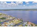 Expansive aerial view of the waterfront community, highlighting the home's access to open water at 3025 Curry Ter, Port Charlotte, FL 33981