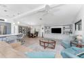 Spacious living room featuring luxury vinyl flooring, built-in shelving and an open floor plan at 867 Cascade Ct, Englewood, FL 34223