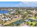 A scenic aerial view of the canal front homesite with dock, waterfront, and lush greenery at 500 Green Dolphin S Dr, Placida, FL 33946