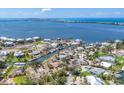 An aerial view of a canal front homesite with lush greenery and beautiful waterfront views at 500 Green Dolphin S Dr, Placida, FL 33946