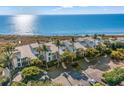 Coastal condominiums with lush landscaping and peekaboo ocean views are the perfect place to relax at 5000 Gasparilla Rd # 8B, Boca Grande, FL 33921