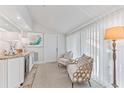 Inviting sitting room with luxury furnishing, decor, and lots of natural light at 5000 Gasparilla Rd # 8B, Boca Grande, FL 33921