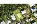 Aerial view of the property with highlighted boundary lines in a neighborhood setting at 9270 Little Gasparilla Is, Placida, FL 33946