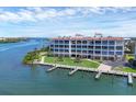 Waterfront condo building with private docks, lush landscaping, and breathtaking water views at 11100 Hacienda Del Mar Blvd # G-304, Placida, FL 33946