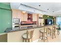 Kitchen featuring granite countertops, stainless steel appliances, and a breakfast bar with seating at 1375 Beach Rd # 201, Englewood, FL 34223