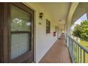 Exterior view of unit 204 showing covered walkway at 1730 Manasota Beach Rd # 204, Englewood, FL 34223
