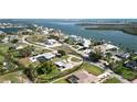 Stunning aerial view of waterfront homes showcases the neighborhood's desirable location and beautiful coastal setting at 310 Green Dolphin Dr, Placida, FL 33946