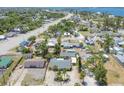 Neighborhood aerial showcasing cozy homes near a long highway and waterway views at 39 1St Ave, Englewood, FL 34223