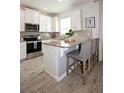 Well-appointed kitchen featuring stainless steel appliances, granite countertops, and stylish bar stool seating at 5009 Skyview Ln, Bradenton, FL 34211