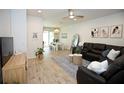Cozy living room with modern decor and ample seating, transitioning seamlessly to the dining area at 5009 Skyview Ln, Bradenton, FL 34211