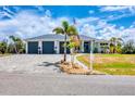 Charming home featuring a spacious three car garage and welcoming landscaping at 530 Spaniards Rd, Placida, FL 33946