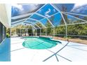 Inviting screened-in pool area, perfect for relaxing and entertaining in privacy at 7247 Brookhaven Ter, Englewood, FL 34224