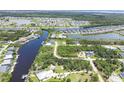 Scenic aerial view of a waterfront neighborhood with canals, homes, and lush greenery at 8127 Consul St, Port Charlotte, FL 33981