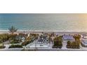 Expansive aerial view of a beachfront estate, showcasing its prime location and beautiful surroundings at 8500 Manasota Key Rd, Englewood, FL 34223
