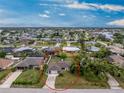 Aerial view of the single-story home, located in a waterfront community, near parks and conservation areas at 1337 Le Pera Rd, Englewood, FL 34223