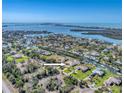 Stunning aerial view shows the beautiful waterfront homes with direct access to the Gulf of Mexico at 285 Spaniards Rd, Placida, FL 33946