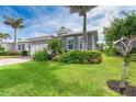 Charming single Gathering home with a beautiful lawn and mature landscaping at 10487 Coquina Ct, Placida, FL 33946