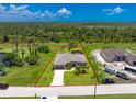 Aerial view showing property lines of home with a large yard at 1119 Boundary Blvd, Rotonda West, FL 33947