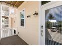 Side view of the home showing the well-maintained exterior with window, door and accent lighting at 11780 Anglers Club Dr # 107, Placida, FL 33946