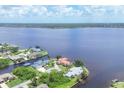 Aerial view of waterfront community with waterfront homes and canal access to the river at 12438 Prather Ave, Port Charlotte, FL 33981