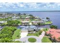 Waterfront home with dock, beautifully landscaped, and is located on a canal in an upscale community at 12438 Prather Ave, Port Charlotte, FL 33981