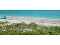 Stunning ocean view overlooking a sandy beach with ocean waves at 1760 Gulf Blvd # 511, Englewood, FL 34223