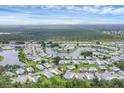 Panoramic aerial view showcasing a waterfront community with lush landscaping and winding waterways at 742 Portwine Ct # 17, Englewood, FL 34223