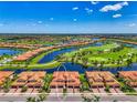 Beautiful aerial view showcasing the property's location, with a lake and golf course at 10788 Tarflower Dr # 201, Venice, FL 34293