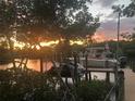 Private boat dock providing waterfront access, perfect for boating and sunsets at 1415 Bayshore Dr, Englewood, FL 34223