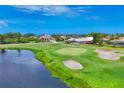 Houses overlooking a beautiful golf course, pond, and sand trap at 200 Arlington Dr, Placida, FL 33946