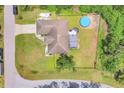 Overhead view of a house showcasing the backyard, fenced yard, and inground pool at 2679 Armenia Rd, North Port, FL 34286