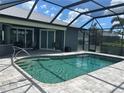 Inviting screened-in pool with a brick paver deck, perfect for outdoor relaxation and entertainment at 7130 Scarlet Sage Ct, Punta Gorda, FL 33955