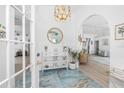 Inviting foyer with beautiful tiled flooring, decorative lighting, and arched entryway leading to the living area at 926 Boundary Blvd, Rotonda West, FL 33947