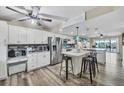 Spacious eat-in kitchen features stainless appliances and a large island with bar seating at 1401 S Mccall Rd # 205, Englewood, FL 34223