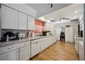 Bright kitchen with white cabinetry, modern appliances, and durable countertops at 27581 Tierra Del Fuego Cir, Punta Gorda, FL 33983