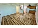 Spacious living room with hardwood floors and abundant natural light, seamlessly connected to the kitchen area at 300 Dalton Blvd Blvd, Port Charlotte, FL 33952