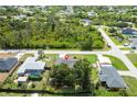 A serene residential neighborhood with lush greenery and well-spaced homes at 7104 Castilla St, Port Charlotte, FL 33981