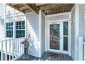 Welcoming condo entrance with a charming nautical theme and storm door access at 7500 Palm Island S Dr # 2111, Placida, FL 33946